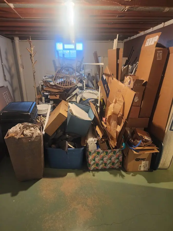 Roll-off dumpster container at job site for 6 Yard Dumpster Rental in Astoria