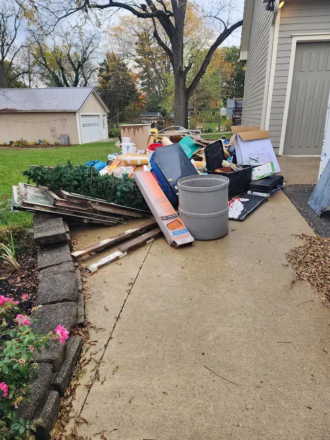 Dumpster being loaded with debris for 3 Yard Dumpster Rental in Astoria